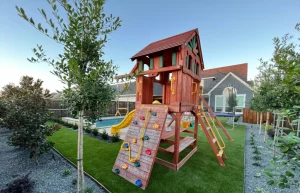 Pave-n-turf-backyard-with-playground.webp